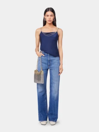 Kenmerkende jeans met metalen schijfjes uit 1969